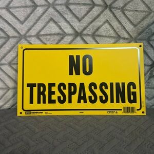 Yellow No Trespassing Sign
